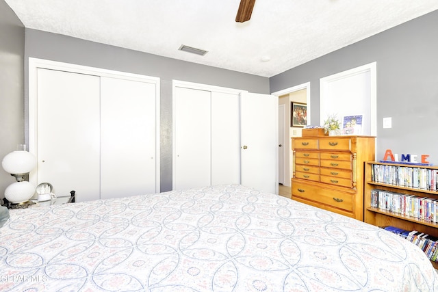 10605 Park View Cir, El Paso, TX 79935 - bedroom with multiple closets and ceiling fan