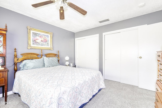 10605 Park View Cir, El Paso, TX 79935 - carpeted bedroom with two closets and ceiling fan