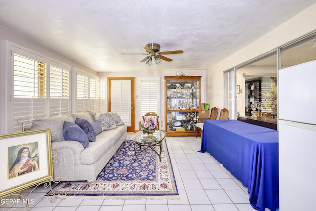 10605 Park View Cir, El Paso, TX 79935 - living area with a ceiling fan and light tile patterned floors