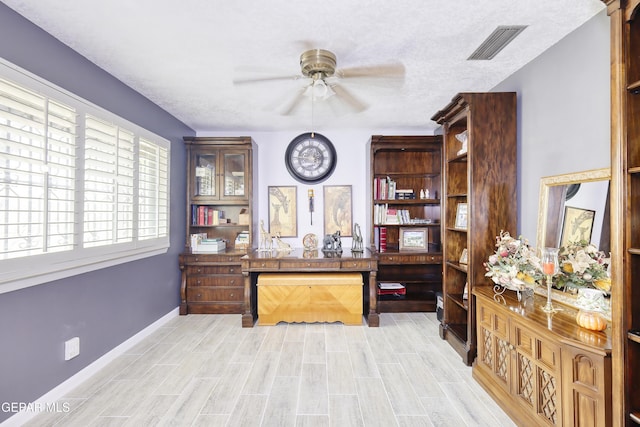 10605 Park View Cir, El Paso, TX 79935 - home office with ceiling fan, light wood-style flooring, and baseboards