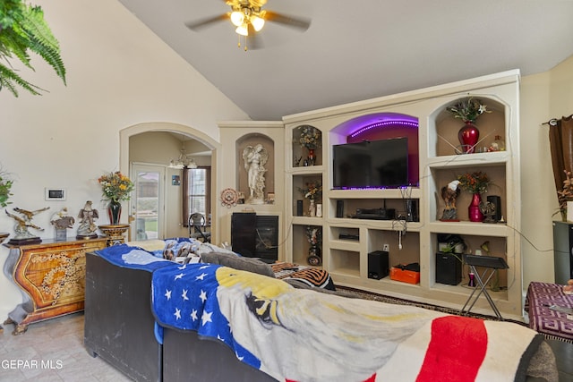 14407 Ocean Point Ln, El Paso, TX 79938 - living area featuring arched walkways, lofted ceiling, ceiling fan, and a fireplace