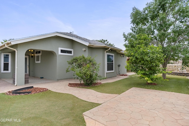 14407 Ocean Point Ln, El Paso, TX 79938 - rear view of house featuring stucco siding, a patio area, and a yard