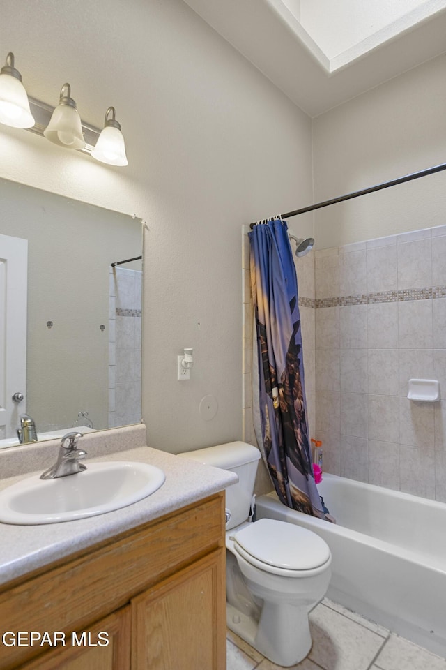 14407 Ocean Point Ln, El Paso, TX 79938 - full bath featuring toilet, vanity, shower / tub combo with curtain, and tile patterned floors
