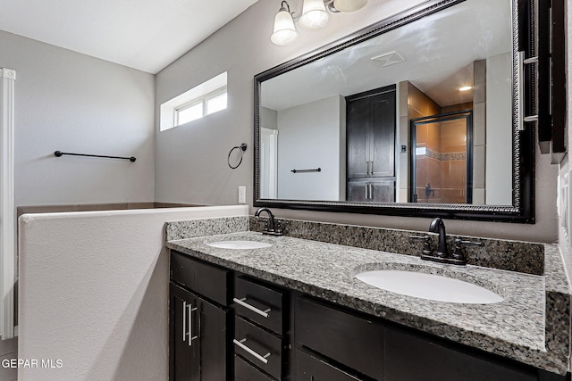 3129 Spring Willow, El Paso, TX 79938 - bathroom featuring double vanity and a shower stall