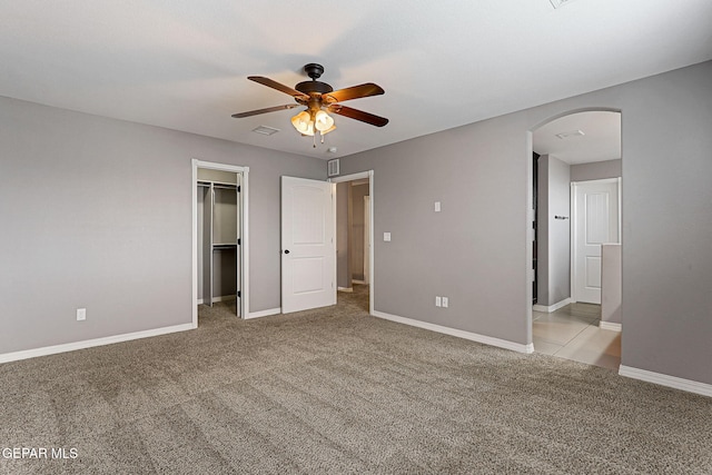 3129 Spring Willow, El Paso, TX 79938 - unfurnished bedroom featuring arched walkways, carpet, baseboards, and a spacious closet