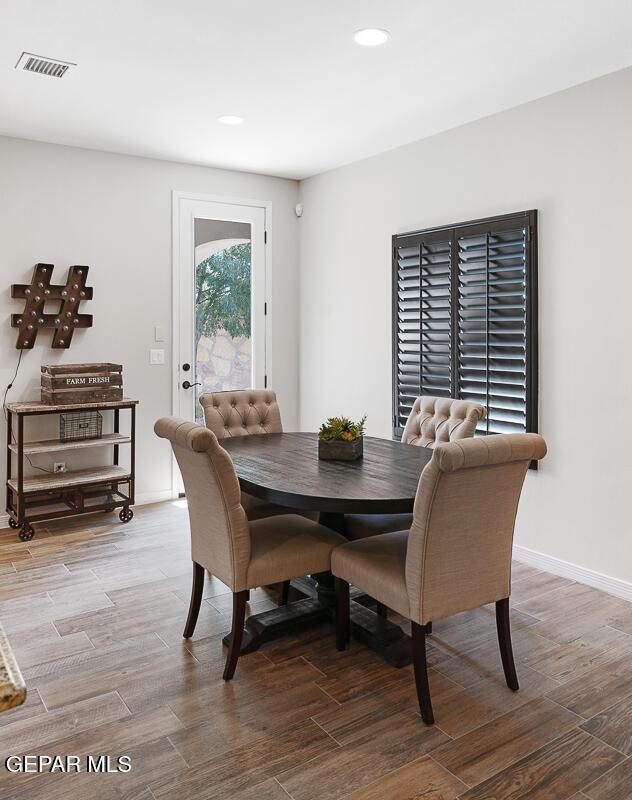 13828 Paseo Bosque Ave, El Paso, TX 79928 - dining room with wood finished floors, recessed lighting, and baseboards
