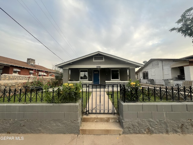 3208 Tularosa Ave, El Paso, TX 79903 - view of front of property featuring covered porch, a fenced front yard, a gate, and brick siding