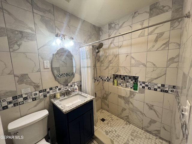 3208 Tularosa Ave, El Paso, TX 79903 - bathroom featuring vanity, toilet, a tile shower, and tile walls
