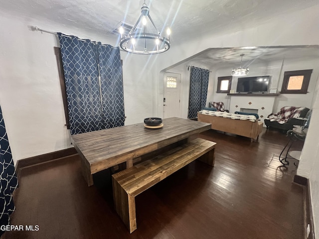 3208 Tularosa Ave, El Paso, TX 79903 - dining area featuring a chandelier and wood finished floors