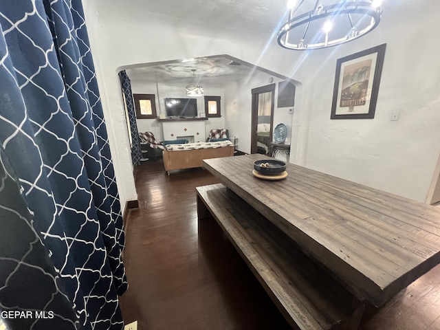 3208 Tularosa Ave, El Paso, TX 79903 - dining room with dark wood-type flooring and a chandelier