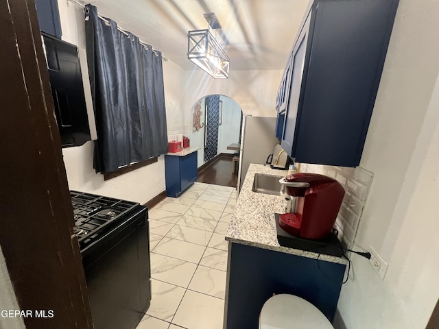 3208 Tularosa Ave, El Paso, TX 79903 - bathroom featuring marble look tile flooring, vanity, and toilet