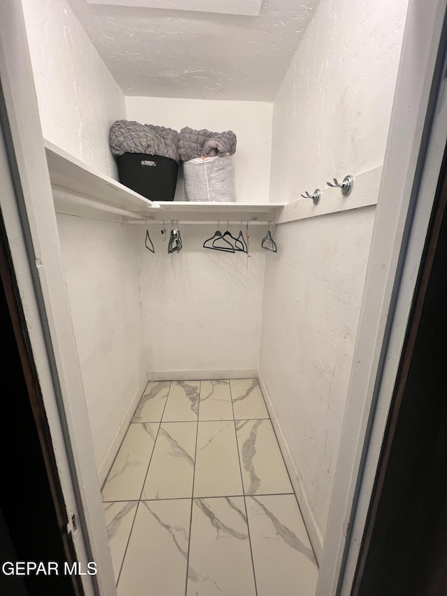 3208 Tularosa Ave, El Paso, TX 79903 - spacious closet featuring marble look tiles