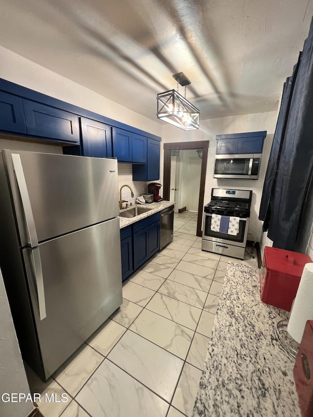 3208 Tularosa Ave, El Paso, TX 79903 - kitchen with appliances with stainless steel finishes, a sink, light marble finish floors, and blue cabinets