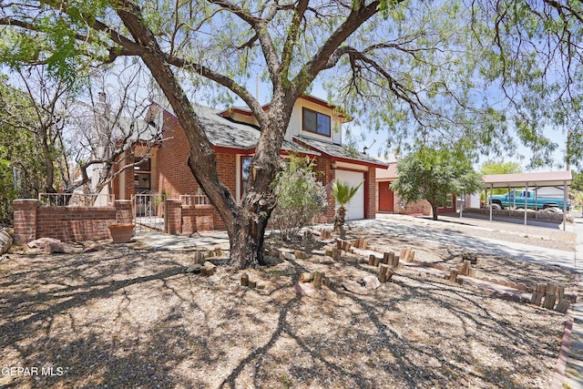 11765 Queens Garden Cir, El Paso, TX 79936 - view of front facade with brick siding and driveway