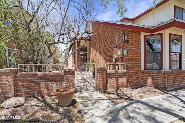 11765 Queens Garden Cir, El Paso, TX 79936 - view of property exterior with a gate and brick siding