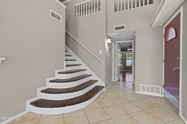 11765 Queens Garden Cir, El Paso, TX 79936 - tiled foyer entrance with baseboards and stairs