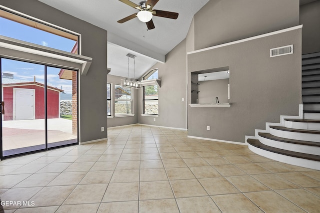 11765 Queens Garden Cir, El Paso, TX 79936 - unfurnished room featuring ceiling fan, tile patterned floors, stairs, high vaulted ceiling, and a chandelier