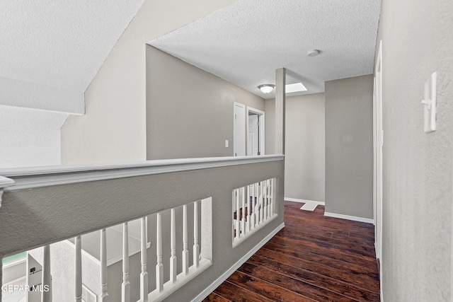11765 Queens Garden Cir, El Paso, TX 79936 - hall featuring wood-type flooring and a textured ceiling