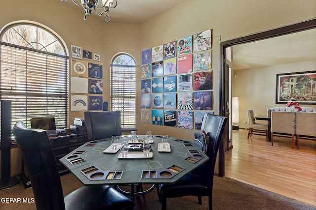 658 John Martin Ct, El Paso, TX 79932 - dining room featuring a chandelier, wood finished floors, and an office area