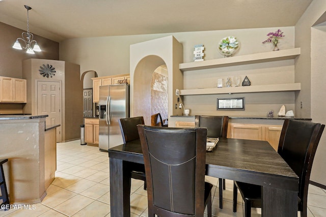 658 John Martin Ct, El Paso, TX 79932 - dining room with light tile patterned flooring, a chandelier, and arched walkways