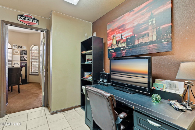658 John Martin Ct, El Paso, TX 79932 - home office with light tile patterned flooring, light carpet, and a textured wall