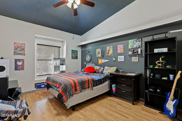 658 John Martin Ct, El Paso, TX 79932 - bedroom featuring light wood-style flooring, lofted ceiling, and a ceiling fan