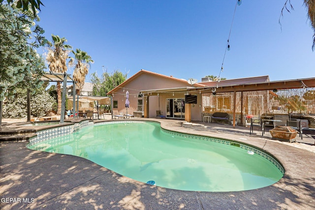 658 John Martin Ct, El Paso, TX 79932 - view of swimming pool with a fire pit, a patio, and a pool with connected hot tub