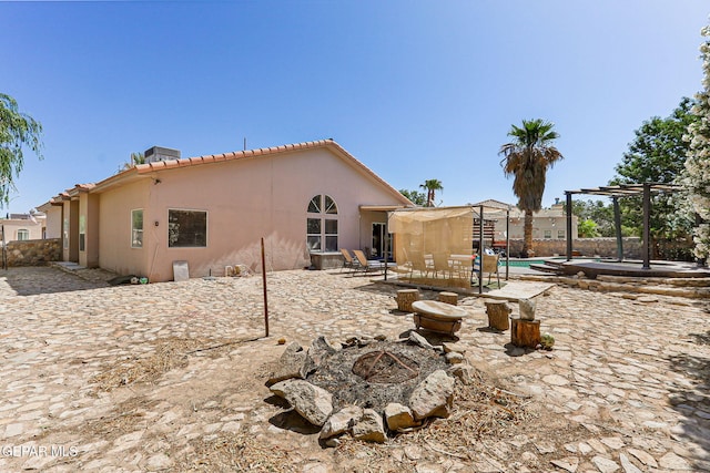 658 John Martin Ct, El Paso, TX 79932 - rear view of house featuring stucco siding, a pergola, a tiled roof, and a patio area