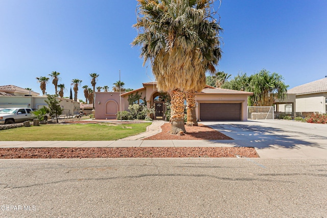 658 John Martin Ct, El Paso, TX 79932 - view of front of home featuring a garage, concrete driveway, stucco siding, and a tile roof
