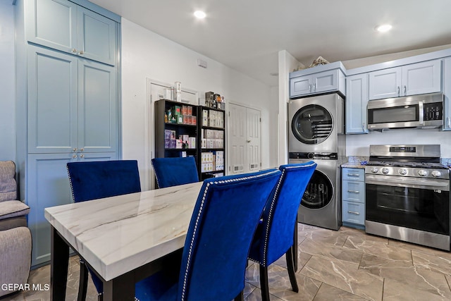 658 John Martin Ct, El Paso, TX 79932 - dining room with estacked washer and dryer, recessed lighting, and light marble finish flooring