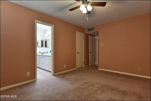 8904 Mettler Dr, El Paso, TX 79925 - unfurnished bedroom with carpet floors, a textured ceiling, and ensuite bathroom