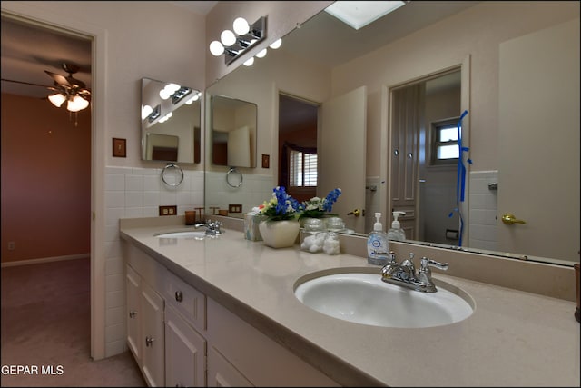 8904 Mettler Dr, El Paso, TX 79925 - full bath with double vanity and a ceiling fan