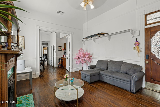 712 N Ochoa St, El Paso, TX 79902 - living area featuring hardwood / wood-style floors, a ceiling fan, and baseboards