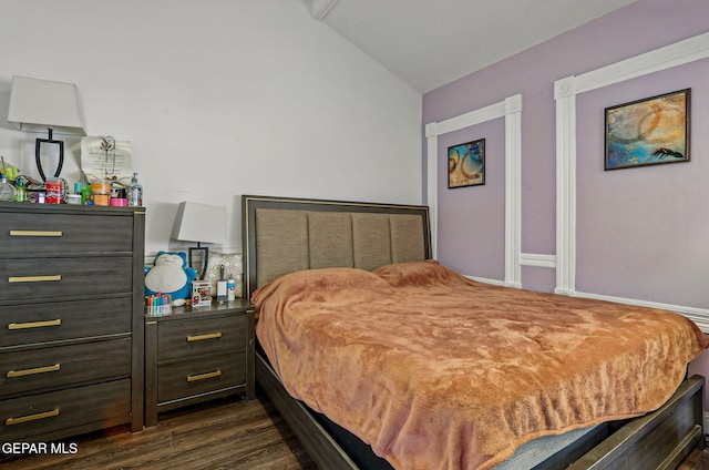 712 N Ochoa St, El Paso, TX 79902 - bedroom with lofted ceiling and dark wood finished floors
