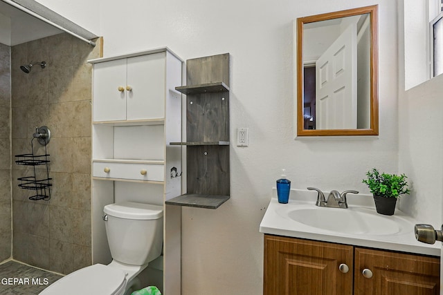 712 N Ochoa St, El Paso, TX 79902 - bathroom with toilet, vanity, and tiled shower