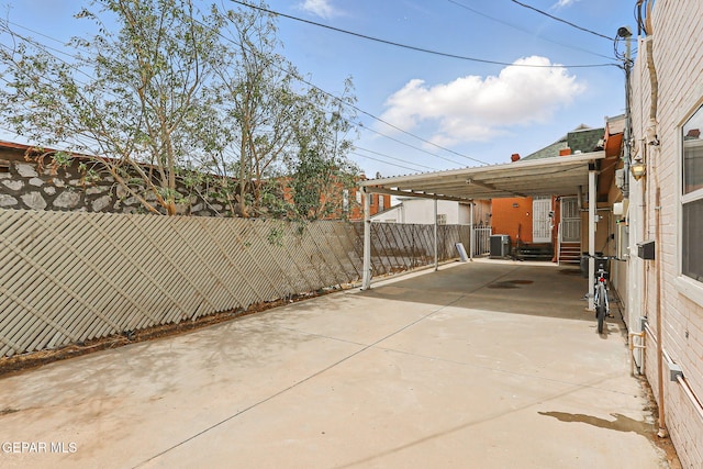 712 N Ochoa St, El Paso, TX 79902 - view of patio with driveway and central air condition unit