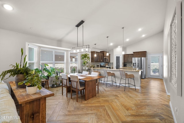 14183 Peyton Edwards Ave, El Paso, TX 79938 - dining space with recessed lighting, lofted ceiling, and baseboards