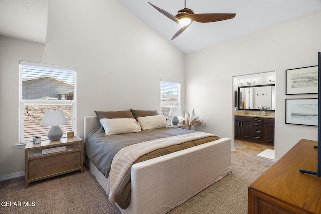 14183 Peyton Edwards Ave, El Paso, TX 79938 - bedroom featuring high vaulted ceiling, connected bathroom, baseboards, light colored carpet, and ceiling fan