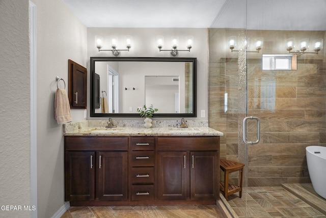 14183 Peyton Edwards Ave, El Paso, TX 79938 - bathroom with a freestanding tub, double vanity, and a shower stall