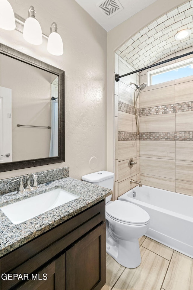 12632 Katherine Brennand Rd, El Paso, TX 79928 - full bathroom featuring vanity, shower / bath combo, and toilet