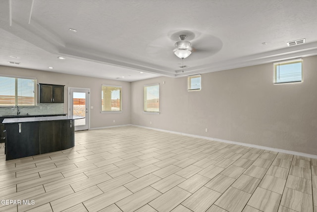 12632 Katherine Brennand Rd, El Paso, TX 79928 - kitchen featuring open floor plan, a ceiling fan, baseboards, recessed lighting, and a sink