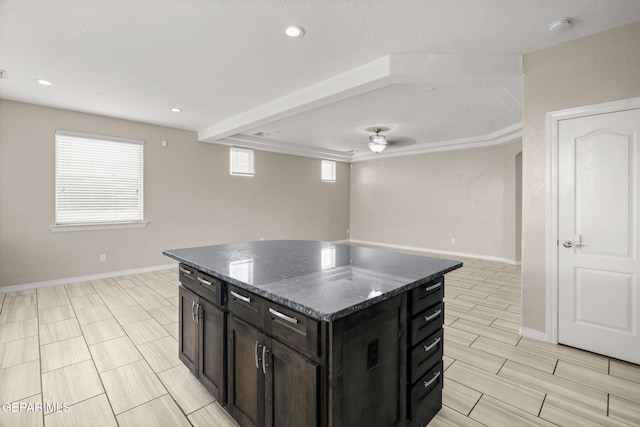 12632 Katherine Brennand Rd, El Paso, TX 79928 - kitchen featuring a center island, open floor plan, baseboards, dark stone counters, and recessed lighting