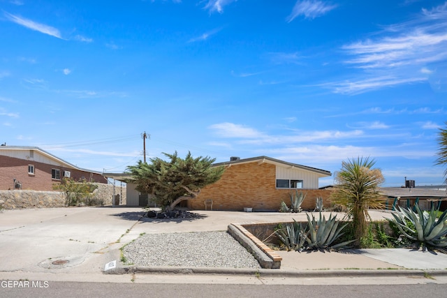 4317 Larchmont Dr, El Paso, TX 79902 - view of front of house with brick siding and concrete driveway