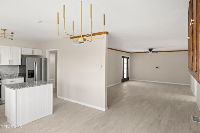 4317 Larchmont Dr, El Paso, TX 79902 - kitchen with stainless steel refrigerator with ice dispenser, baseboards, a ceiling fan, light wood-style floors, and white cabinets