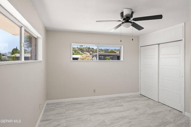4317 Larchmont Dr, El Paso, TX 79902 - unfurnished bedroom featuring a closet, baseboards, a ceiling fan, and light marble finish floors