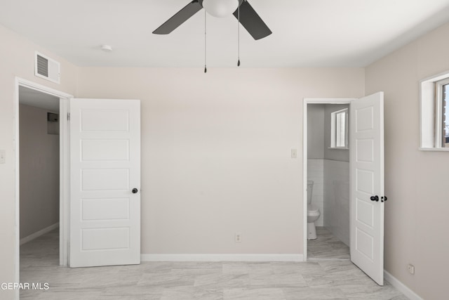4317 Larchmont Dr, El Paso, TX 79902 - unfurnished bedroom featuring baseboards, light marble finish floors, and a ceiling fan