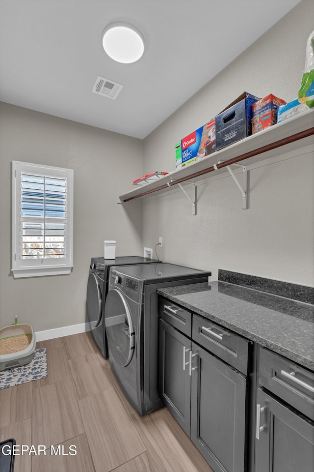 2401 Mike Price Dr, El Paso, TX 79938 - laundry area with washer and clothes dryer, cabinet space, and baseboards