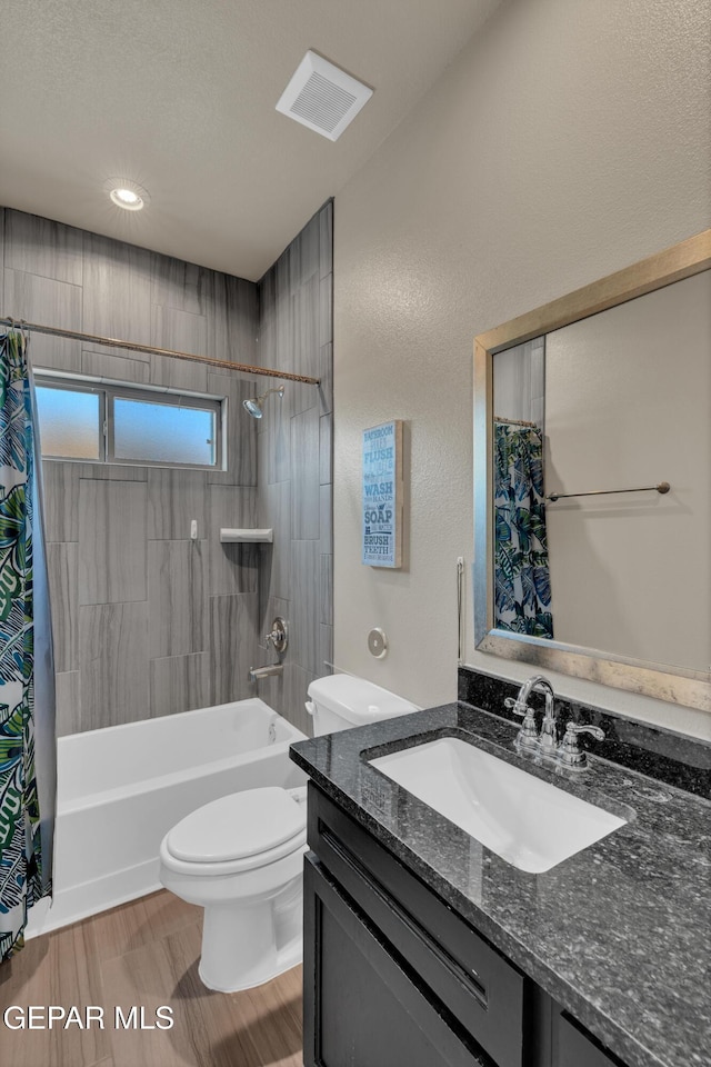 2401 Mike Price Dr, El Paso, TX 79938 - full bathroom with vanity, toilet, shower / tub combo with curtain, wood finished floors, and recessed lighting