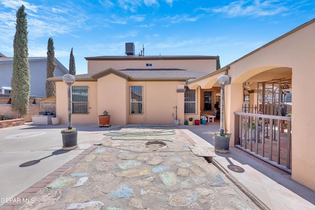 444 Ghost Flower St, Horizon City, TX 79928 - rear view of house featuring a patio area and stucco siding