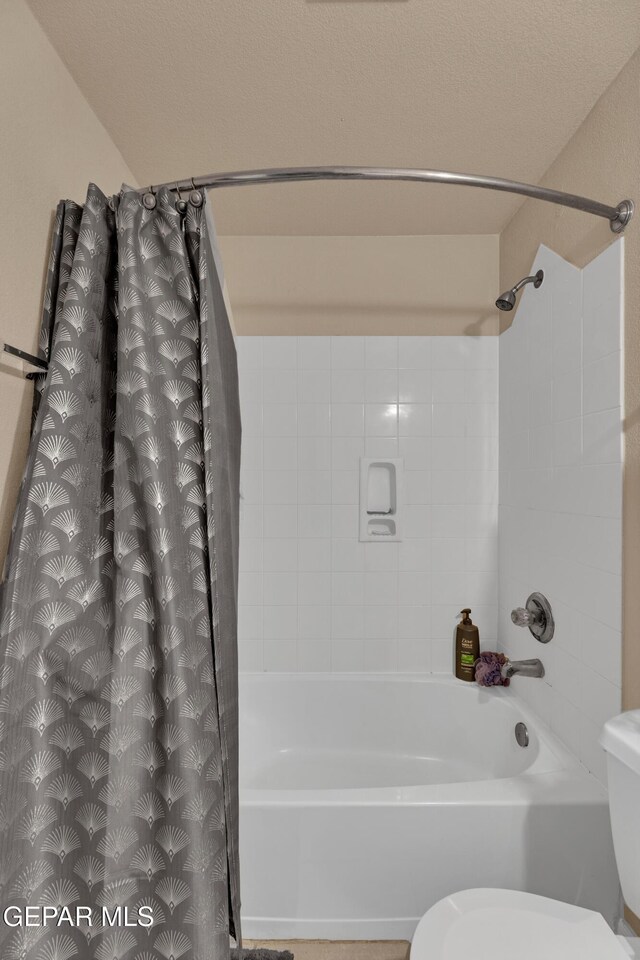 444 Ghost Flower St, Horizon City, TX 79928 - bathroom with shower / tub combo with curtain